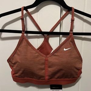Women’s Nike medium light terracotta sports bra.